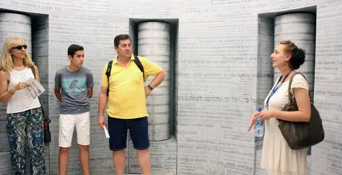 Tour group in Warsaw museum exhibit.