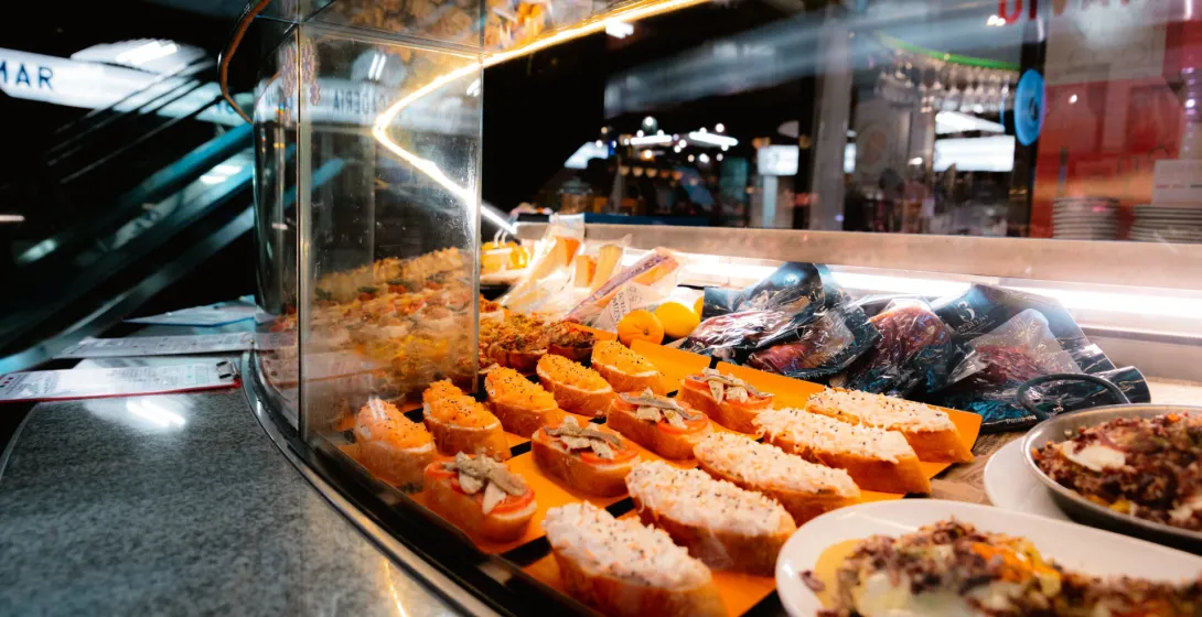 Delicious tapas displayed at a Madrid food stall.