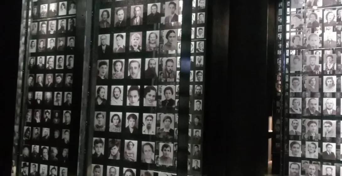 A moving museum exhibit in Gdansk, featuring hundreds of black and white portraits.