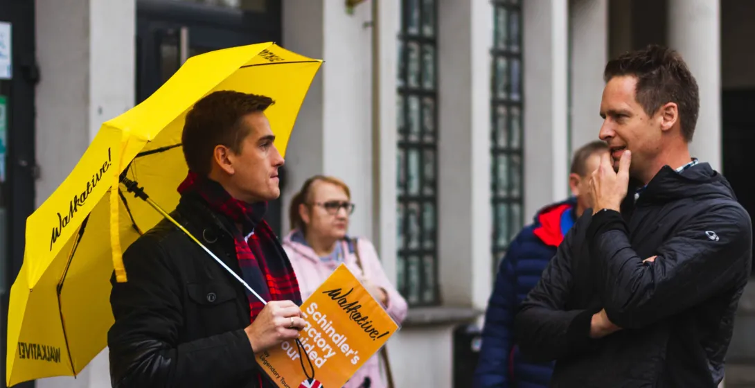 A Walkative! tour guide in Krakow leads a Schindler's Factory tour.