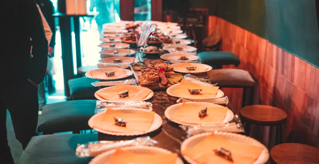 A table set for a food tour in Krakow, Poland, with plates and snacks ready for a group.