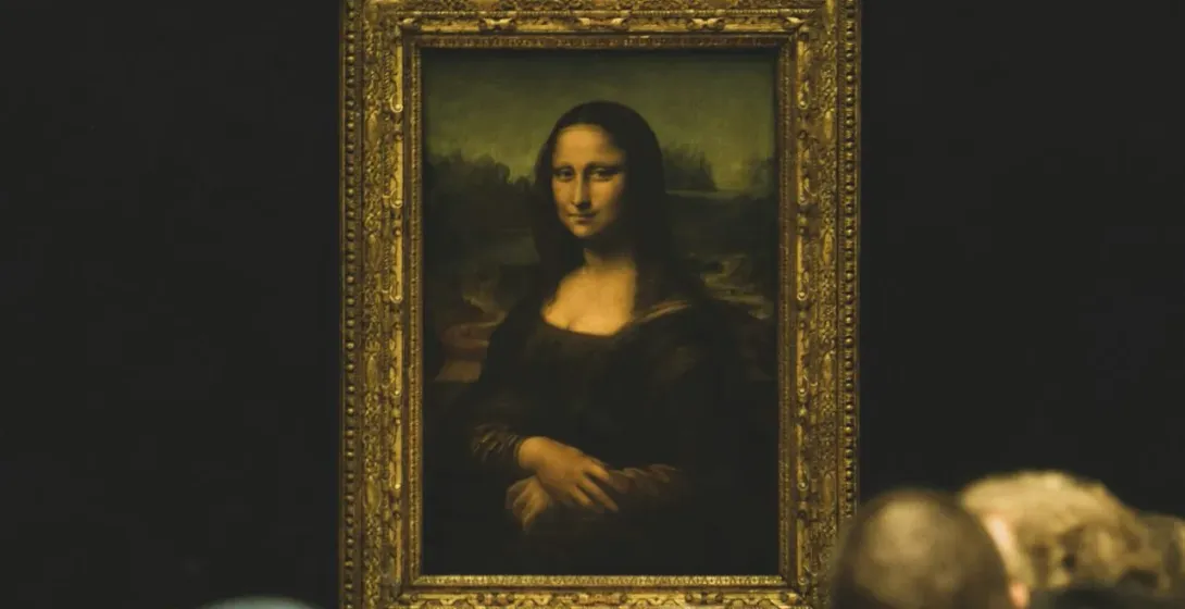 Tourists admiring the Mona Lisa at the Louvre Museum in Paris.
