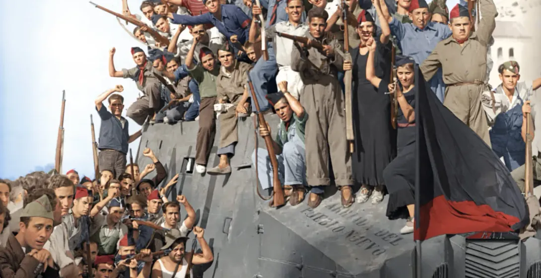 Spanish Republican soldiers celebrate atop an armored car during the Spanish Civil War.