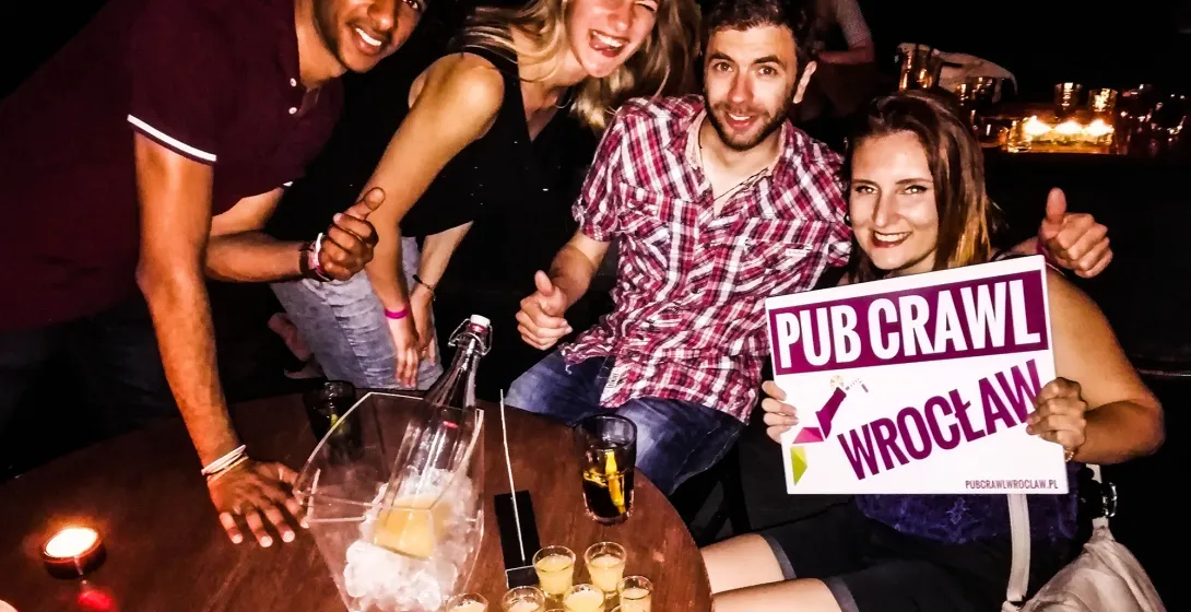 Happy tourists on a Wrocław pub crawl.