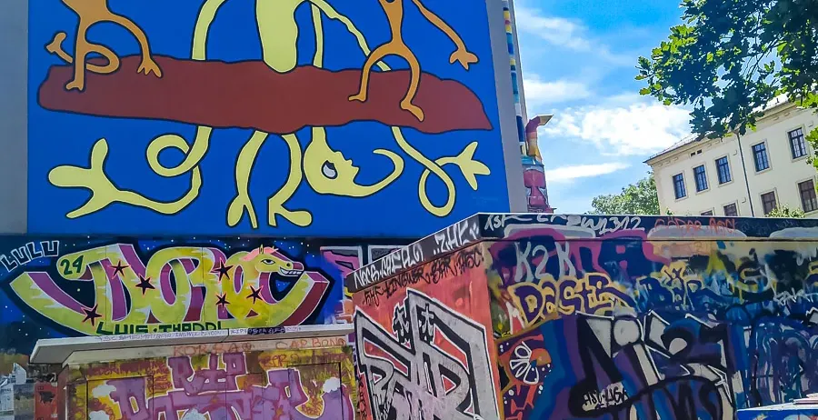 Colorful street art mural and graffiti in a city.