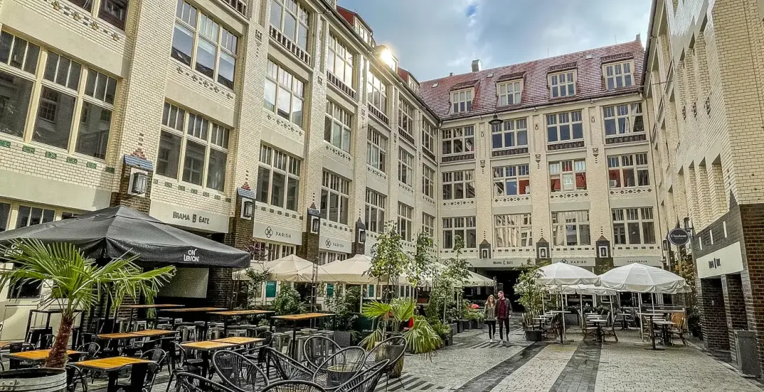 Picturesque courtyard in Wrocław, Poland, with cafes and restaurants.
