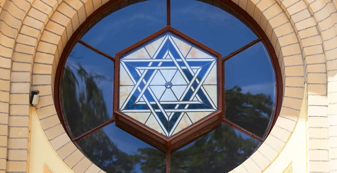 Close-up of a beautiful stained-glass Star of David in a circular window of a building in Wrocław, Poland.