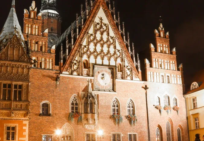 Night view of Wrocław's Old Town Hall, a stunning example of Gothic architecture.