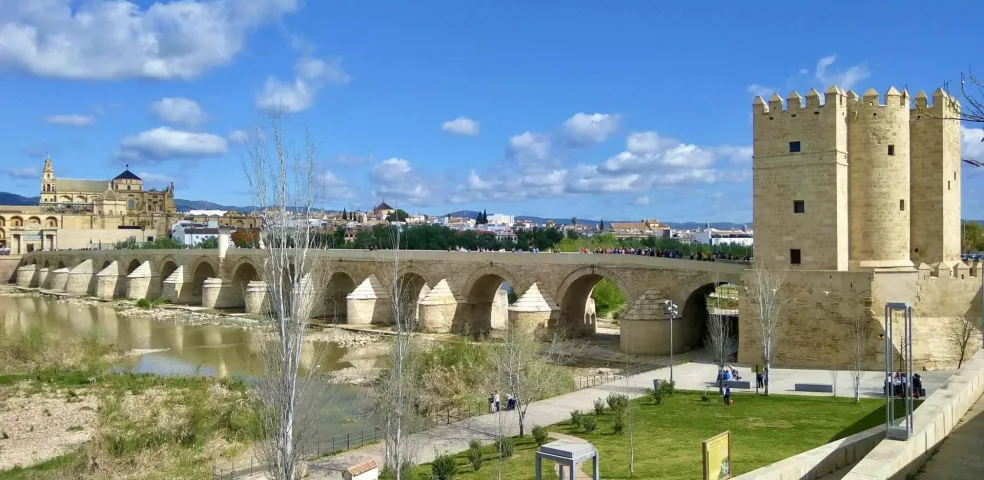 Panoramic view of the Roman Bridge, Guadalquivir River, Torre de la Calahorra, and Mezquita-Cathedral in Cordoba.