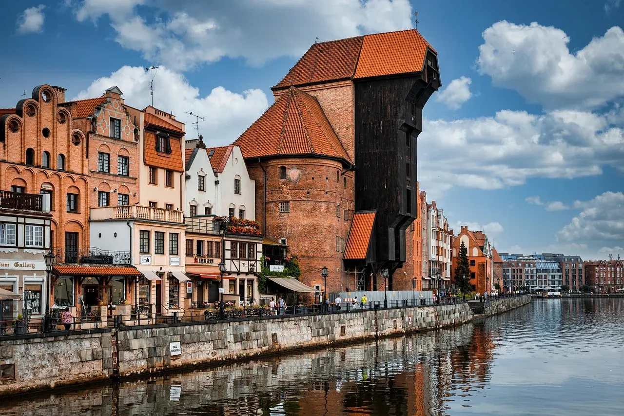 Explore Gdansk's historic waterfront, featuring the iconic Crane and colorful buildings.