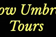 Tekst "Yellow Umbrella Tours" w żółtej, ozdobnej czcionce na czarnym tle.