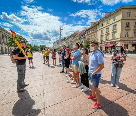 Guided tour group in Warsaw's city center.