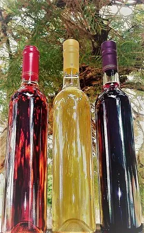 Three bottles of Polish mead, showcasing a variety of colors and flavors.