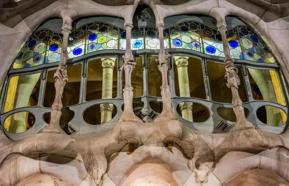Intricate stained-glass window detail at Casa Batlló in Barcelona.