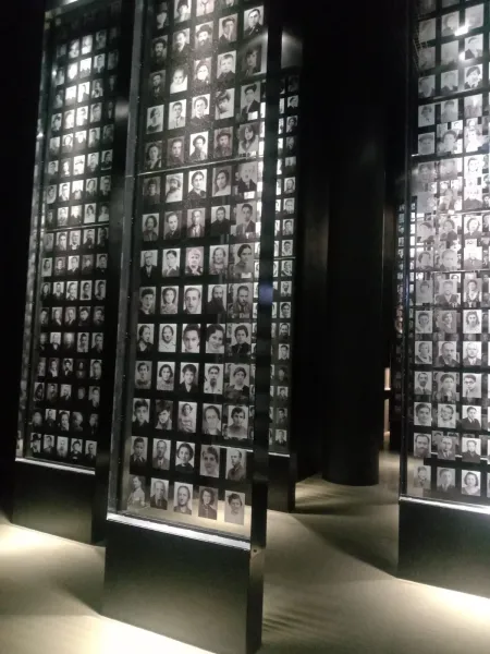A moving museum exhibit in Gdansk, featuring hundreds of black and white portraits.