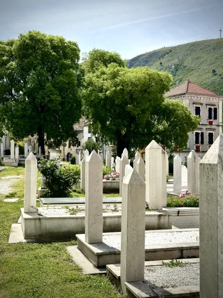 Peaceful cemetery in Kotor, Montenegro, with unique headstones.