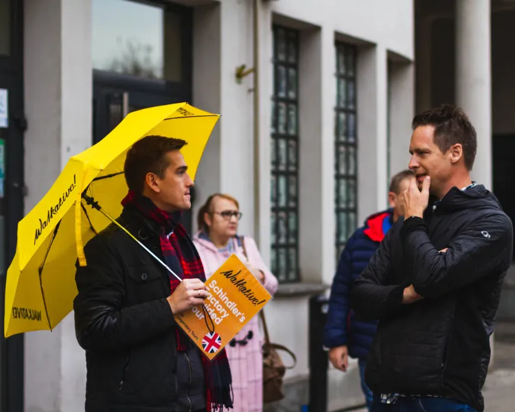 A Walkative! tour guide in Krakow leads a Schindler's Factory tour.