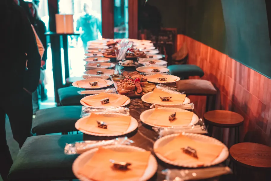 A table set for a food tour in Krakow, Poland, with plates and snacks ready for a group.