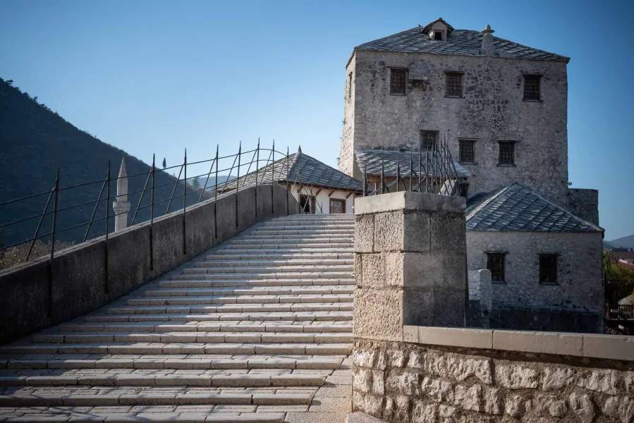 Stone steps leading to the historic Mehmed Paša Sokolović Bridge in Mostar.