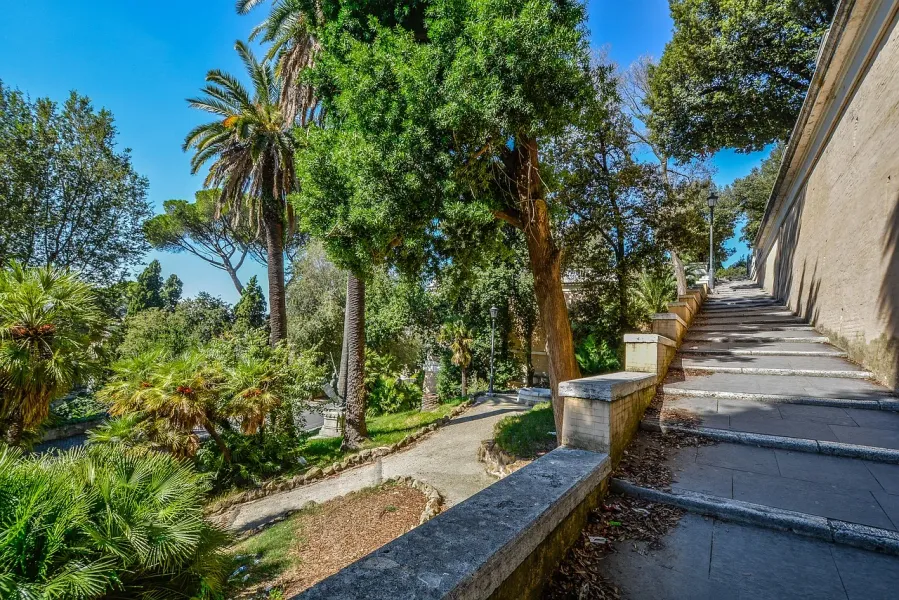 Serene staircase in a Roman garden.