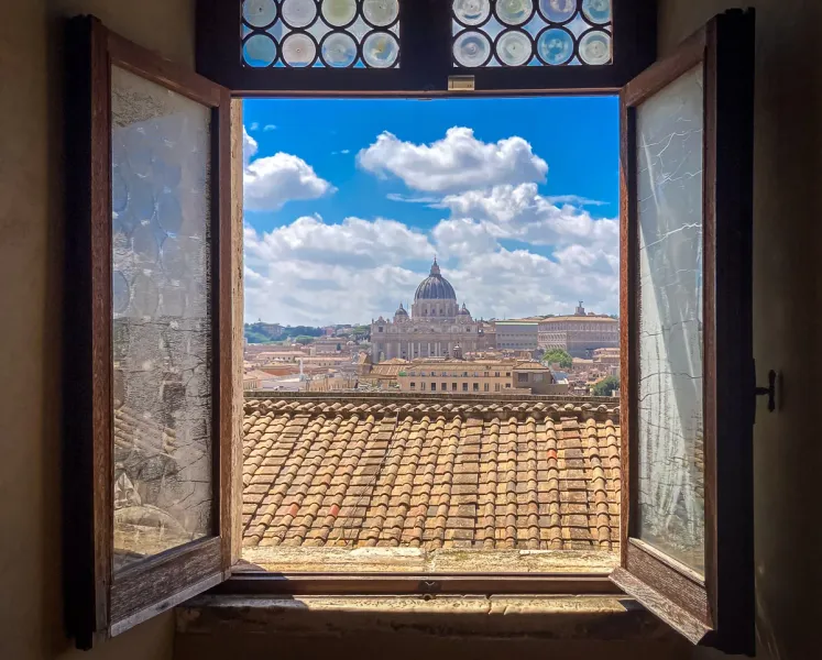 Stunning view of St. Peter's Basilica in Rome from a window.