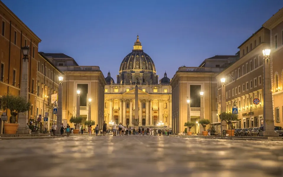 Evening view of St. Peter's Basilica in Vatican City during a Vatican Tour.
