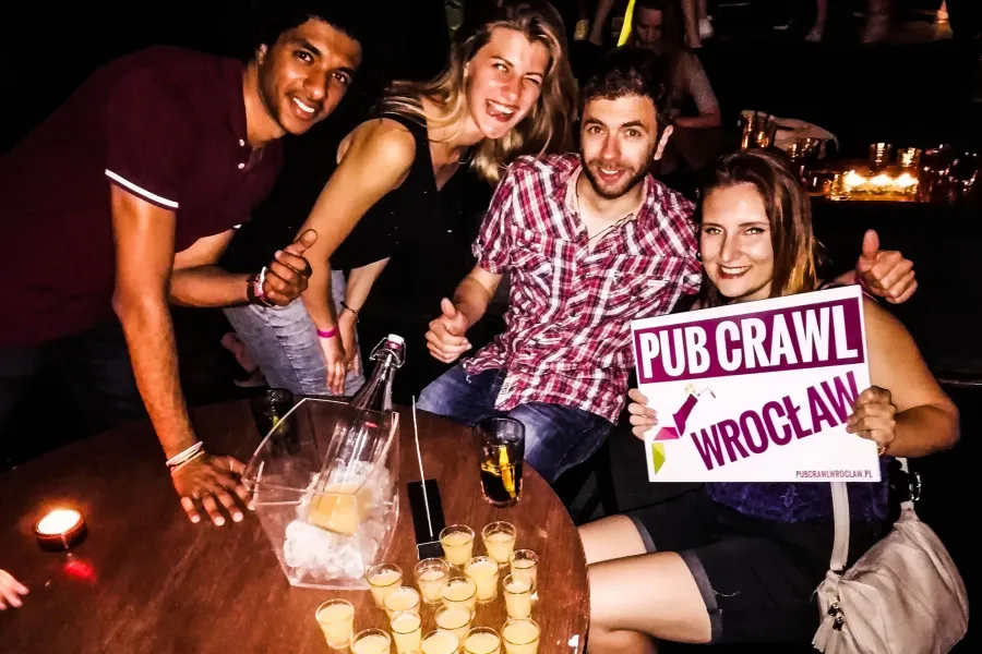 Happy tourists on a Wrocław pub crawl.