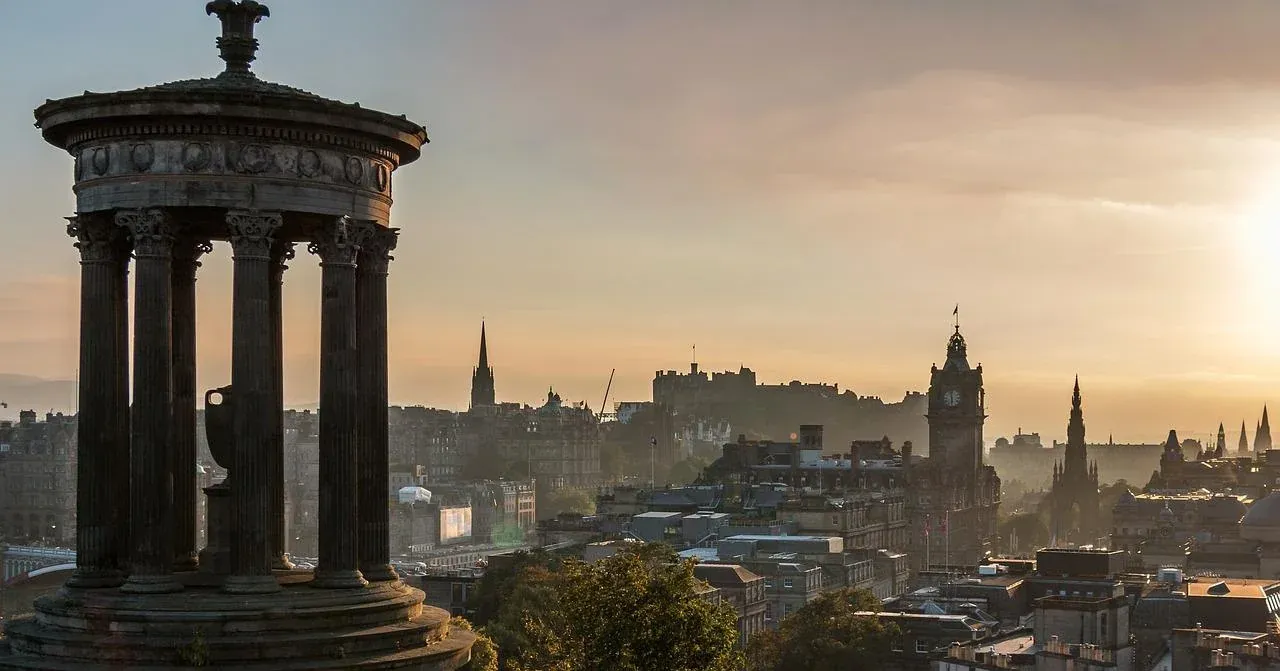 Edinburgh cityscape with Dugald Stewart Monument at sunrise.