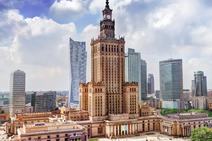 Panoramic view of Warsaw skyline with the Palace of Culture and Science and modern skyscrapers.
