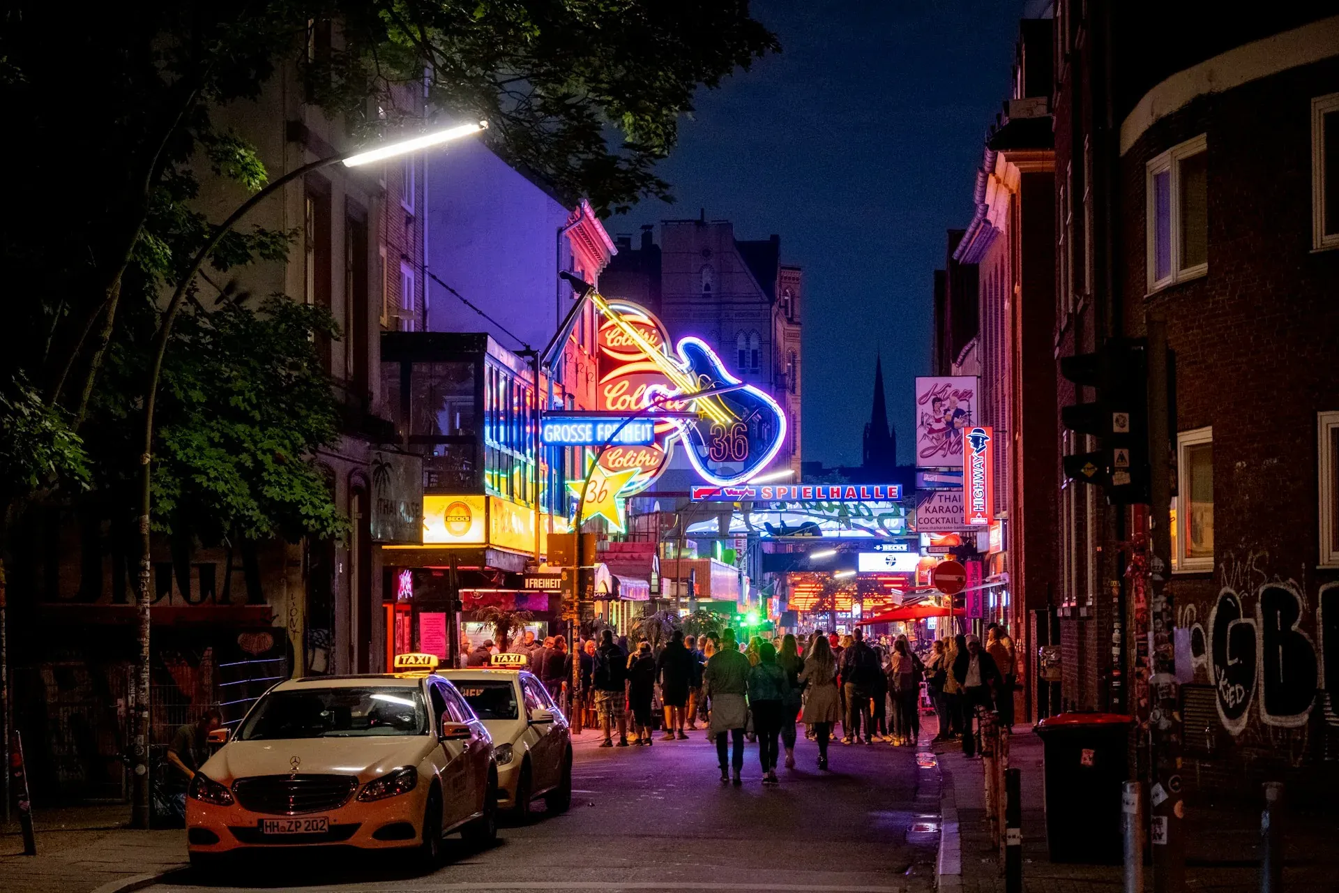 Vibrant nightlife on Grosse Freiheit street in Hamburg, Germany.