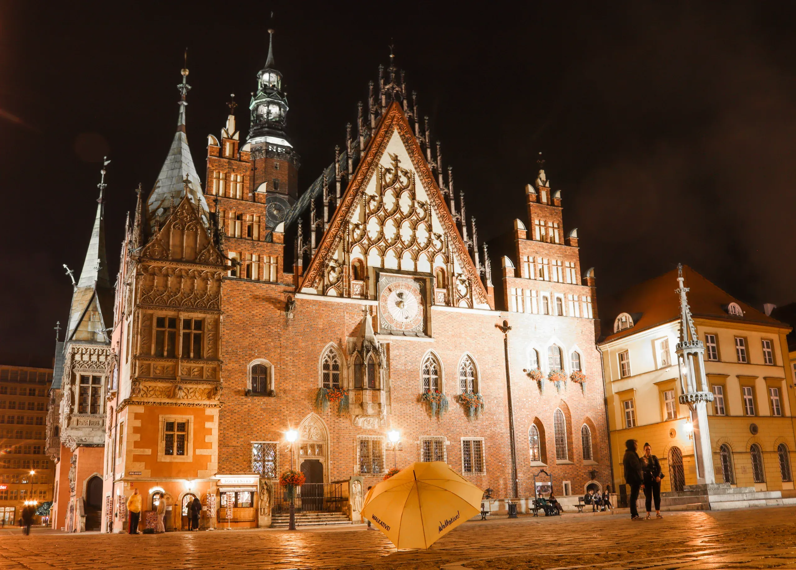 Night view of Wrocław's Old Town Hall, a stunning example of Gothic architecture.