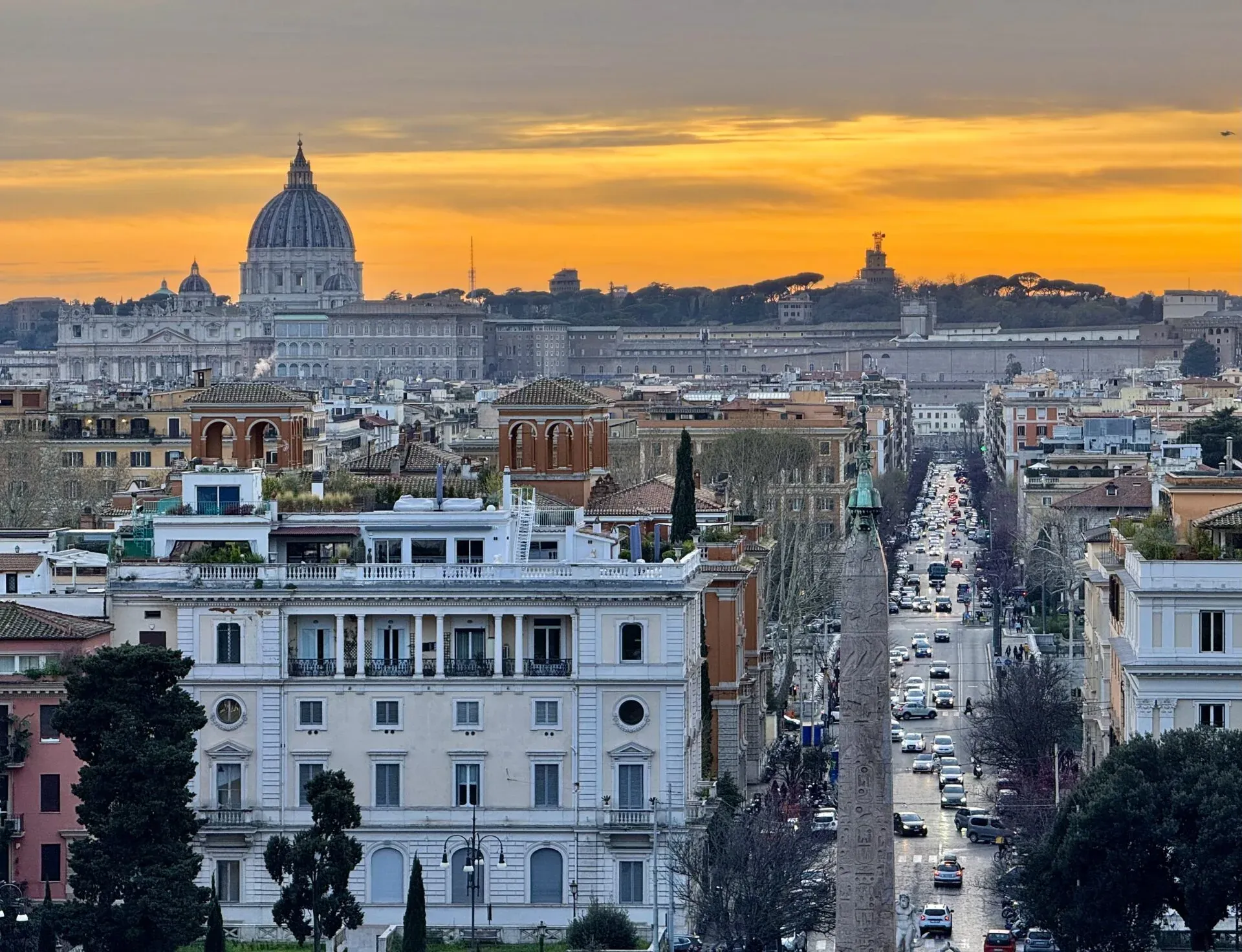 Stunning sunset view of Rome, featuring St. Peter's Basilica.